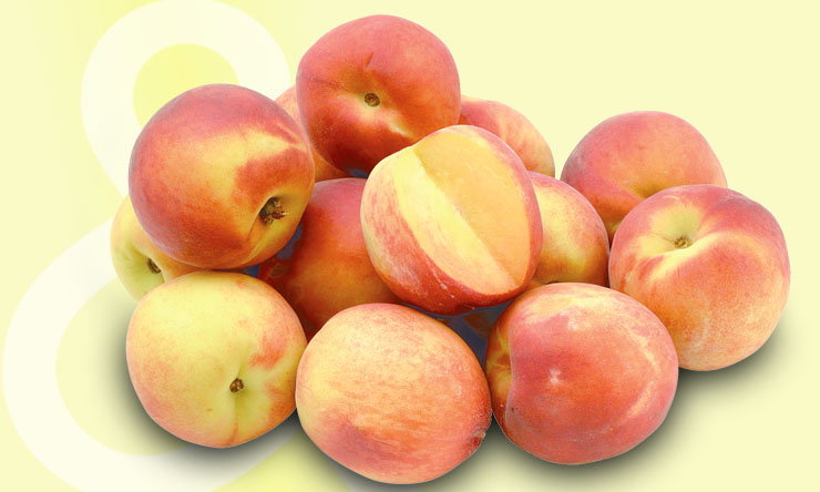 Fresh yellow peaches piled in a bowl